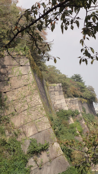 a sideview of an outer wall.  The stone blocks are carved so that there's a curve to the outside of the wall